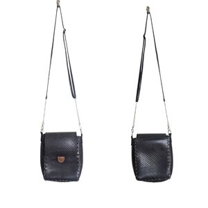 Compact Black Crossbody Bag with Flap Closure and Adjustable Strap